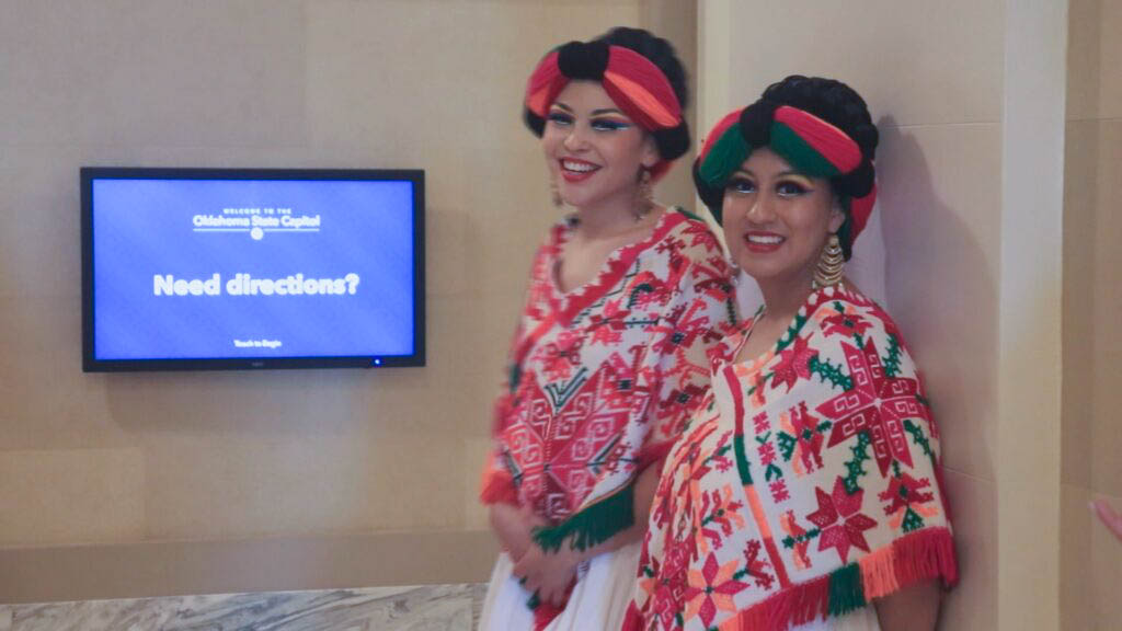 Alejandra Estrada (left) and her dance-mate (right) wait to perform in their traditional Mexican costume. Pictures: Kevin Palomino